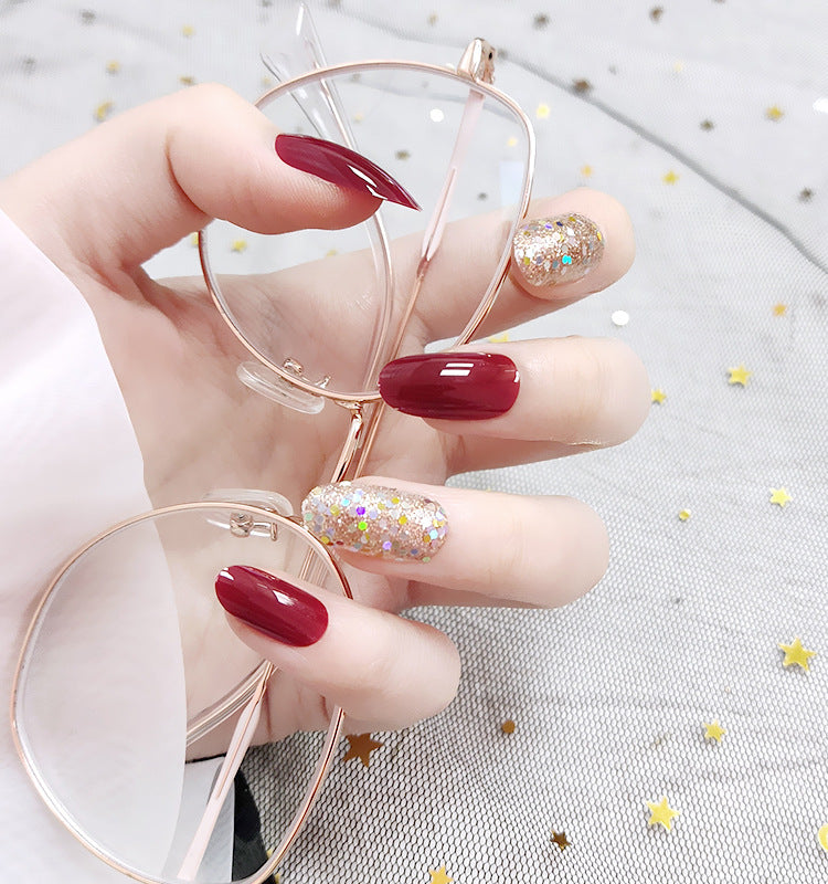 Red Glossy Nails with Gold Shimmer Accent Nails